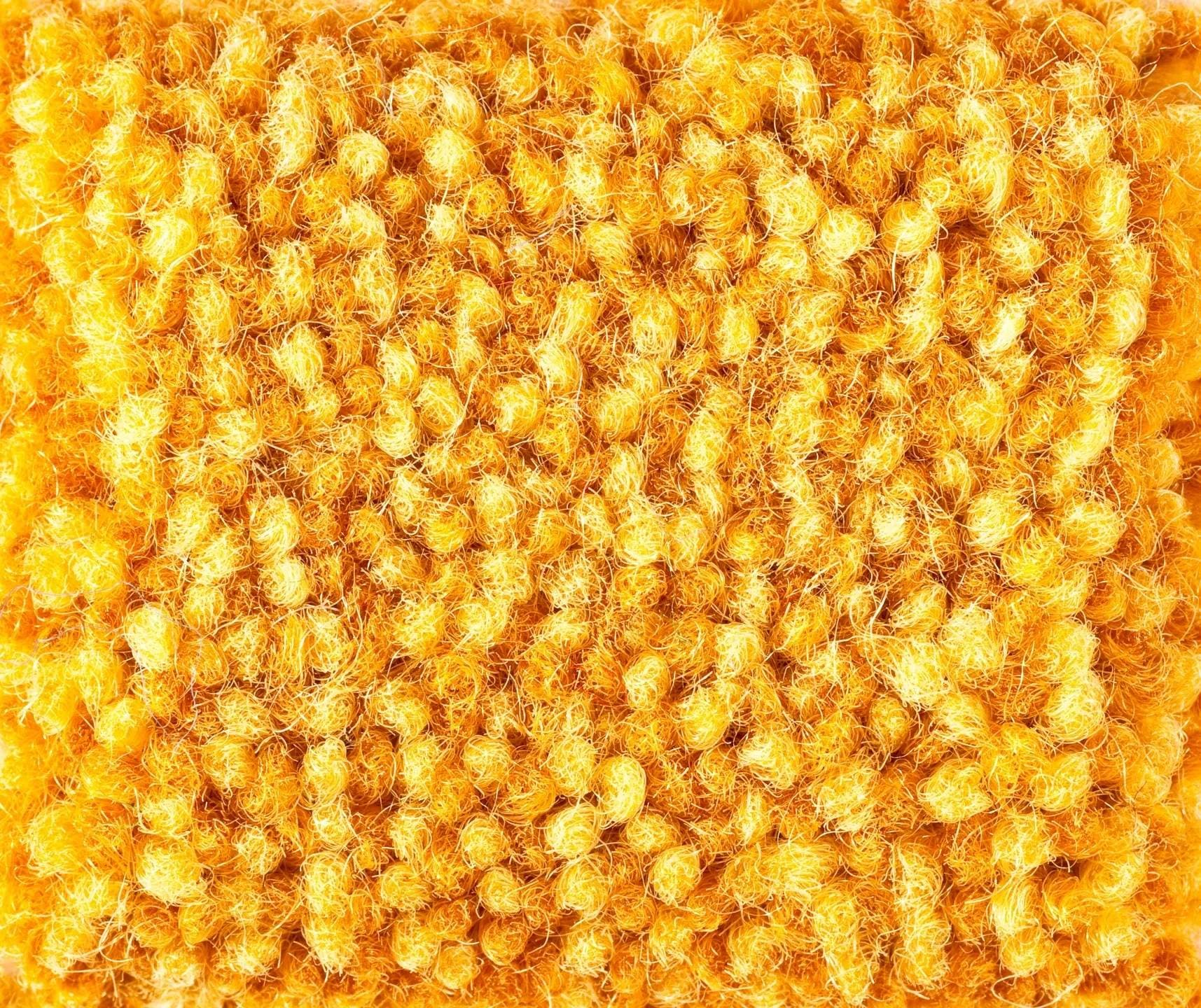 close up of yellow carpet.